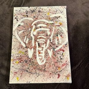 Homemade elephant splatter painting. Size of hand